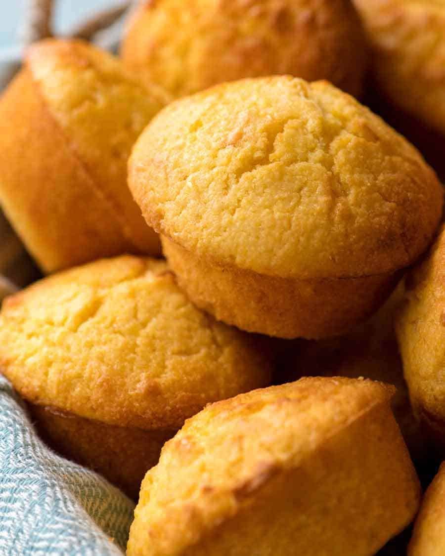 Close up of Cornbread Muffins in a basket, fresh out of the oven