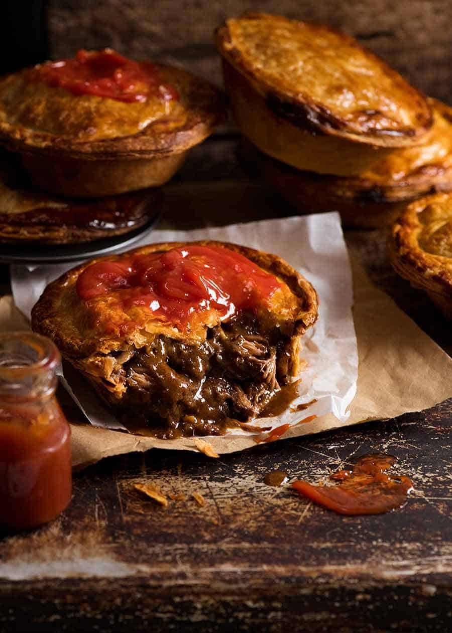 Australian Meat Pie cut open to show filling inside