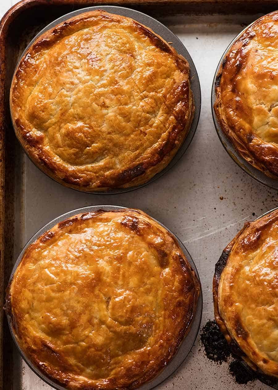 Overhead photo of Australian Meat Pies on a tray, fresh out of the oven