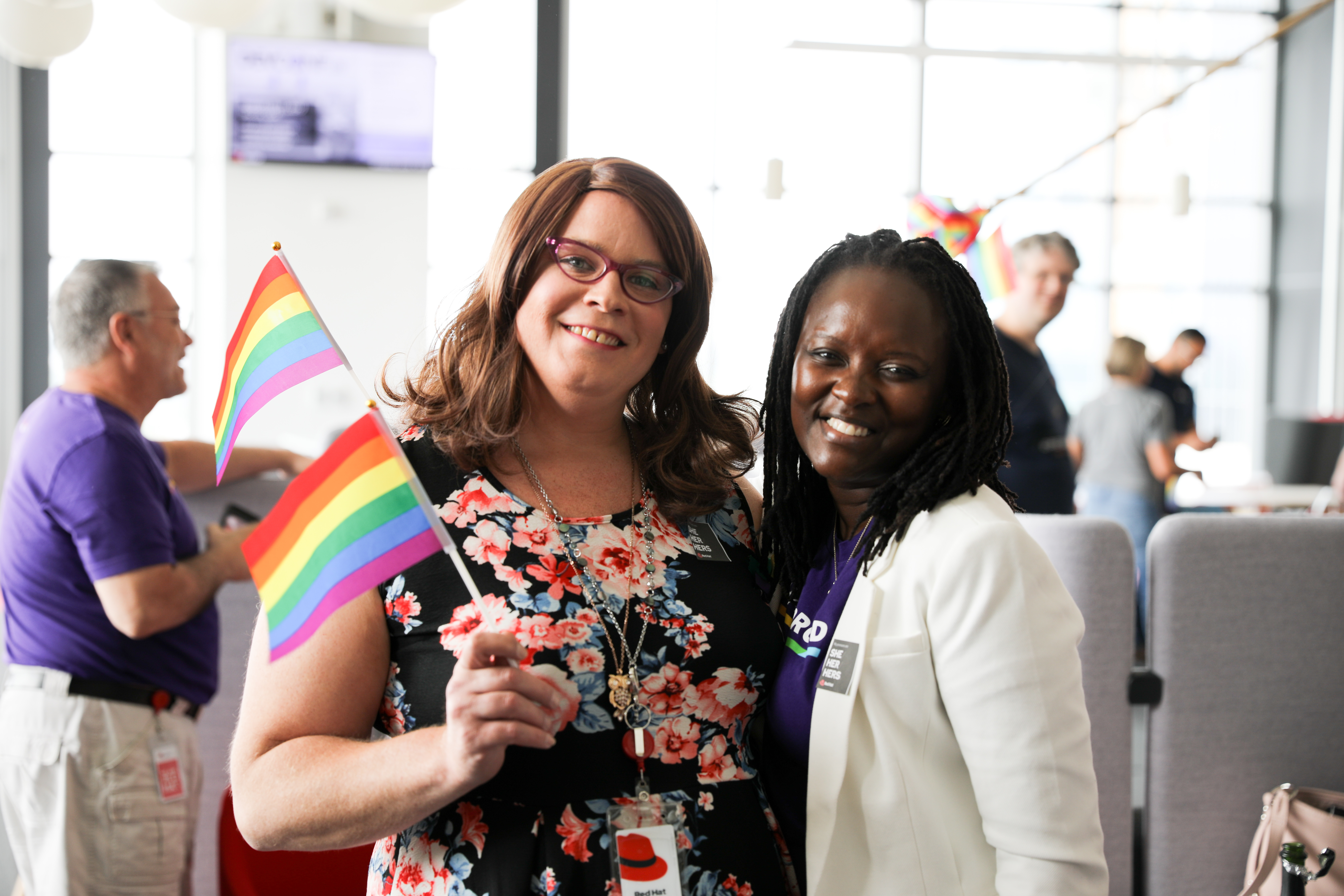 Red Hat Employees holding pride flag