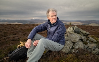 Retired male hiking on a hill in the Aberdeenshire region of Scotland