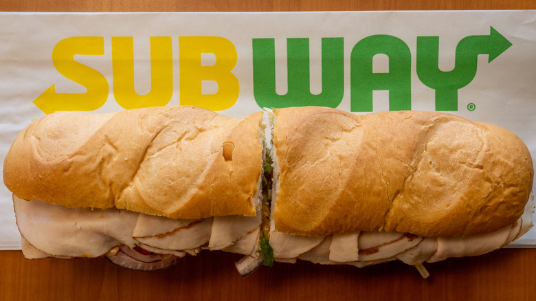 An overhead shot of a Subway sandwich on a napkin