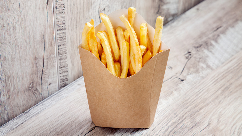 French fries in brown cardboard carton