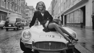 British fashion model Fiona Richmond poses with her FU 2 number plate in 1974