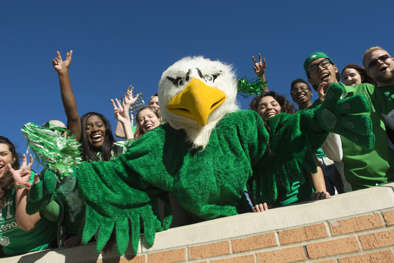 Scrappy in a crowd at the football stadium