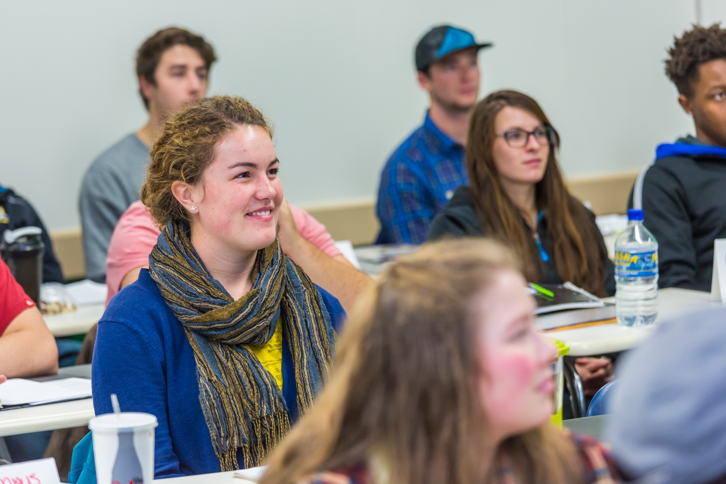 Samantha Knutson and other students listen in during a School of Management marketing class in the Gruening Buildilng.