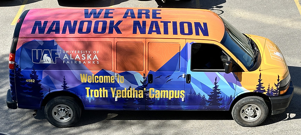 A UAF shuttle sports a new wrap recently installed onto the vehicle. The van will be used primarily for new and prospective students visiting campus, orientations and campus preview days, and airport shuttles. It is also available by request for researchers on the road.