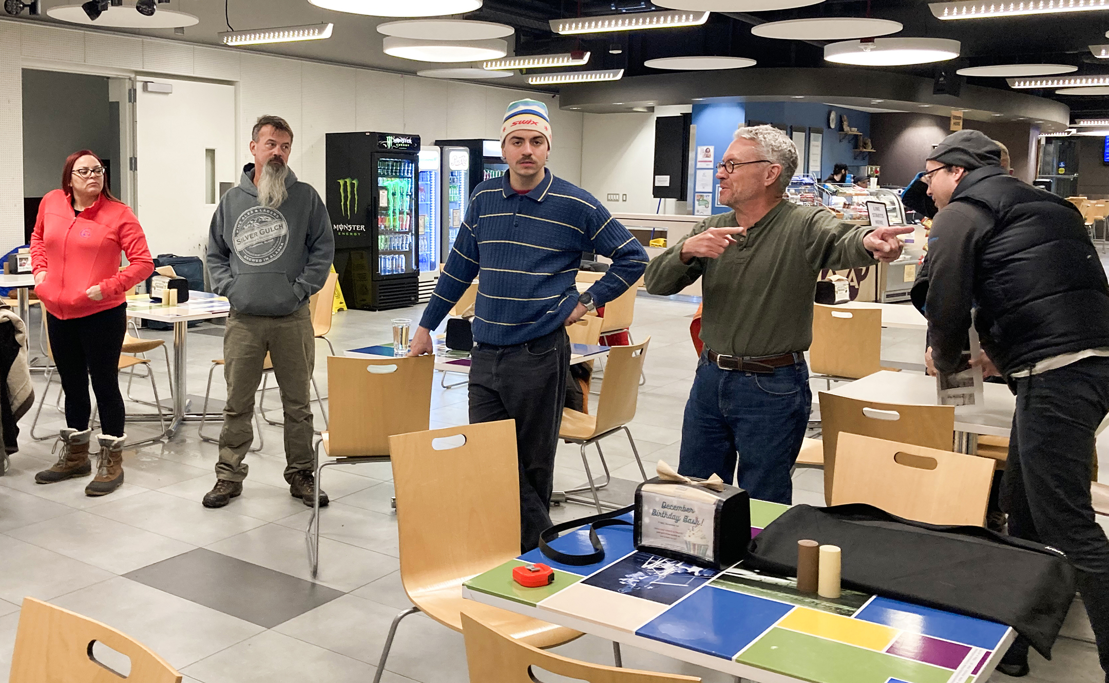 Charles Mason and his students wrap up after hanging the Digi X photographs in Arctic Java.