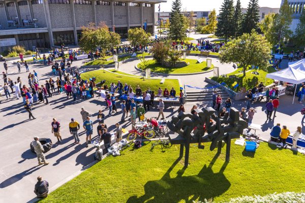 Students visit various booths during a previous Party in the Park event.