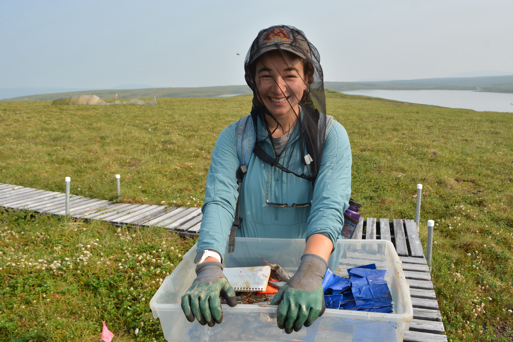 TUNDRA awardee carries field gear in the Arctic tundra near Toolik Field Station.