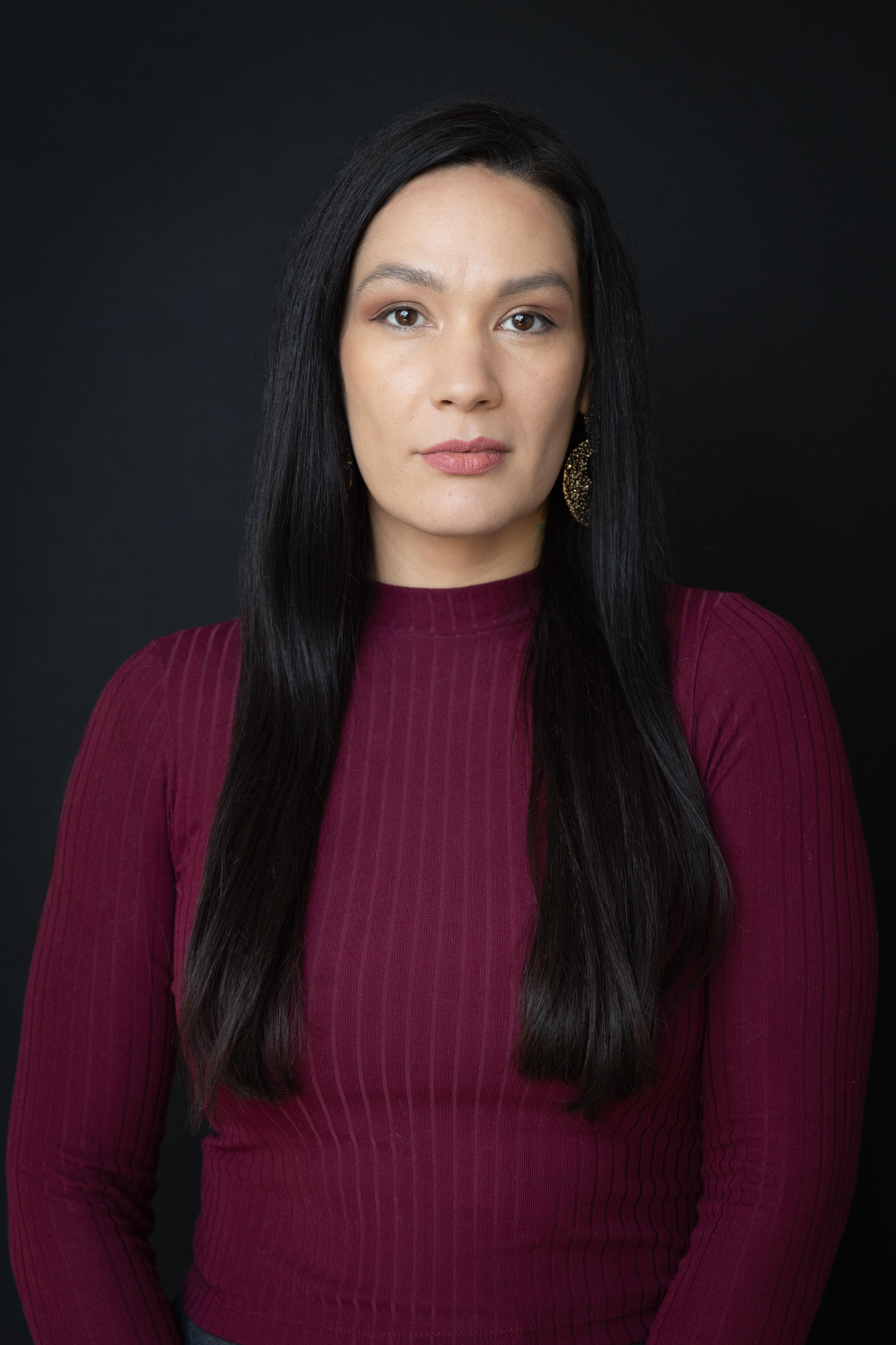 Head and shoulders portrait of comedian Adrianne Chalepah.