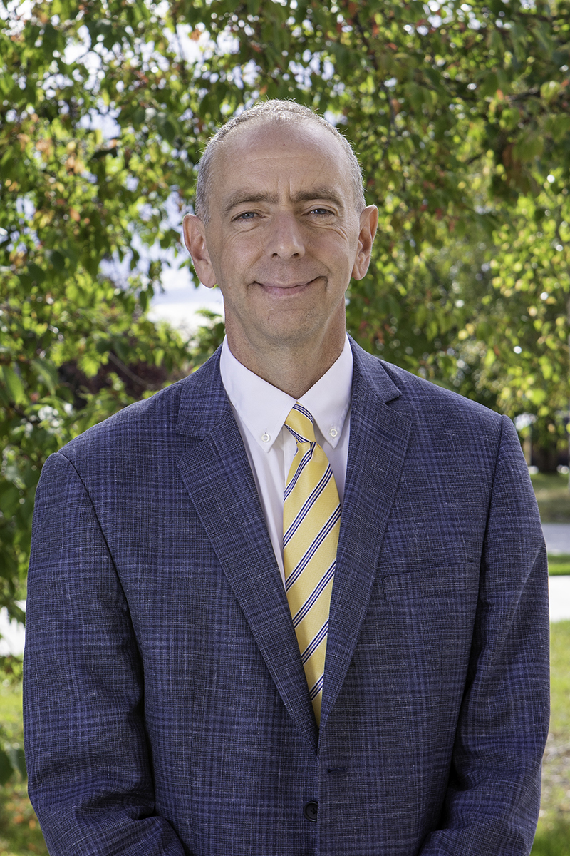 a portrait of a man in a suit