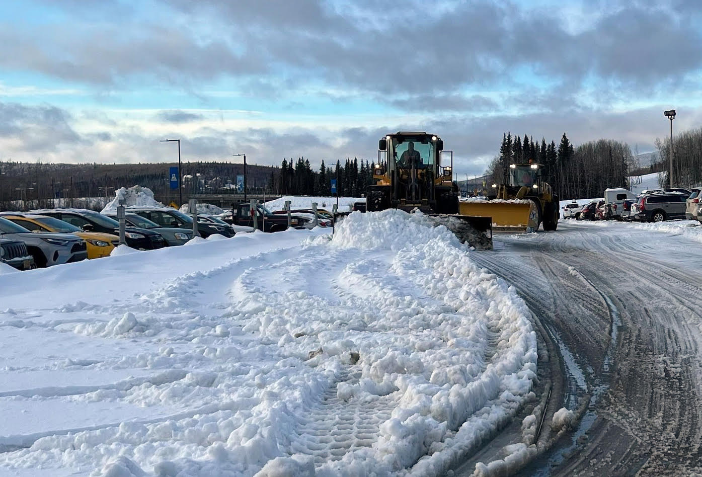 Facilities Services crews work to remove snow, slush and ice from parking lots and walkways after this week’s storm that broke records for 24-hour precipitation levels.