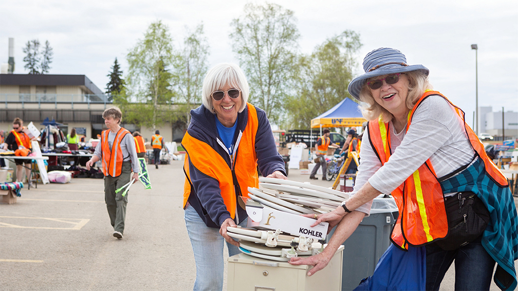 Volunteers find treasures while setting up for the Really Free Market in 2023.