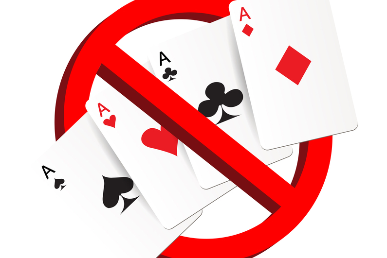 Playing cards and a no entry sign