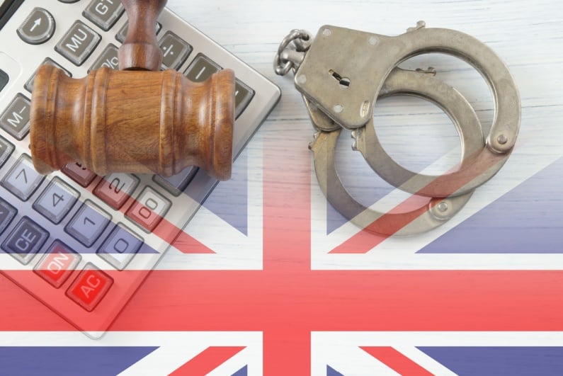 Handcuffs with British flag and gavel