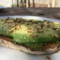 Eating toast (with avocado and dukkah) in the back garden.