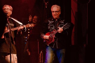 Uncle Joe on guitar and me on mandolin wearing my finest country-themed shirt.