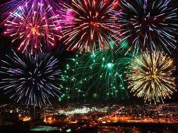 Colorful fireworks on the night sky puzzle online from photo