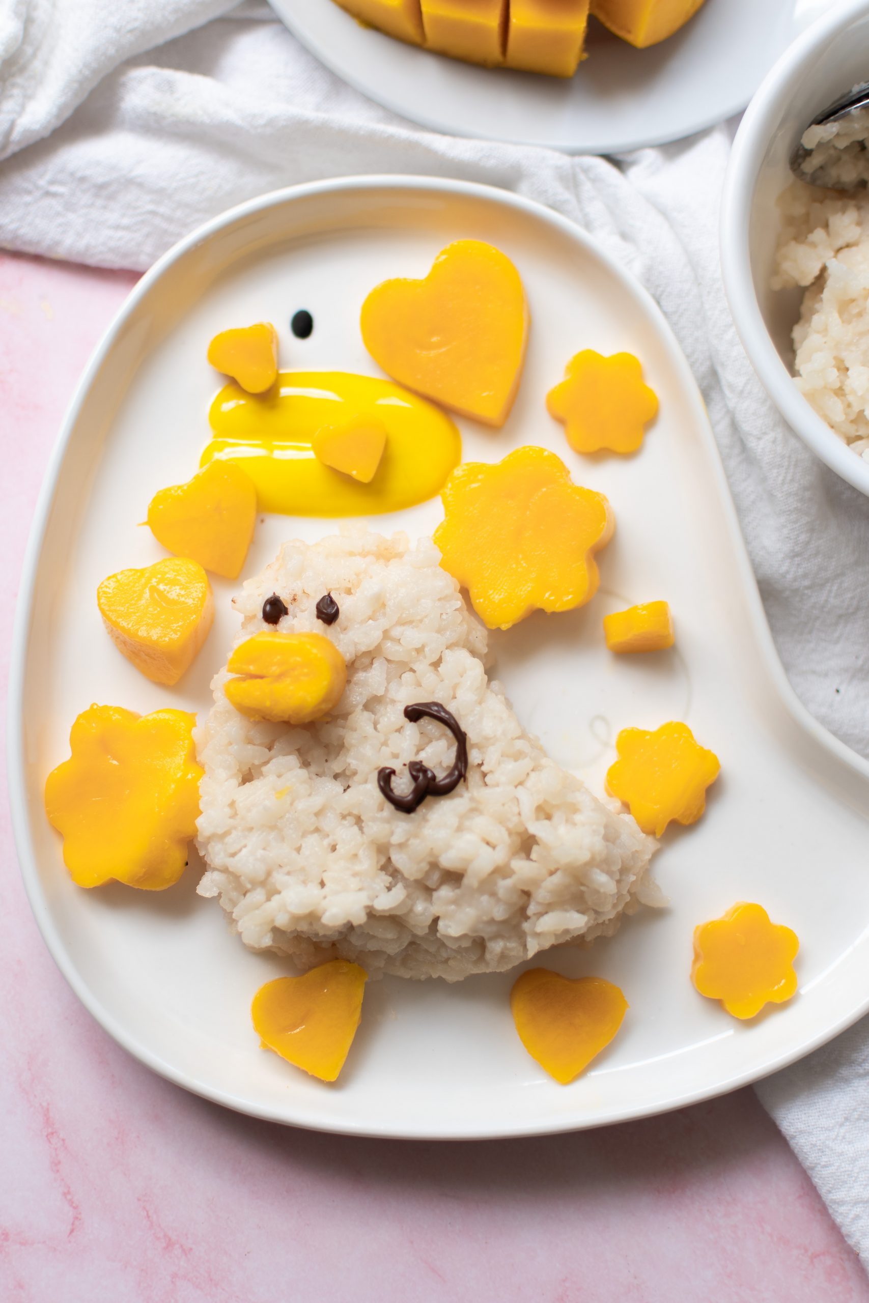 Cute duckie mango sticky rice on a duckie plate