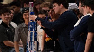 SEC basketball fans stack beer cans in the stands.