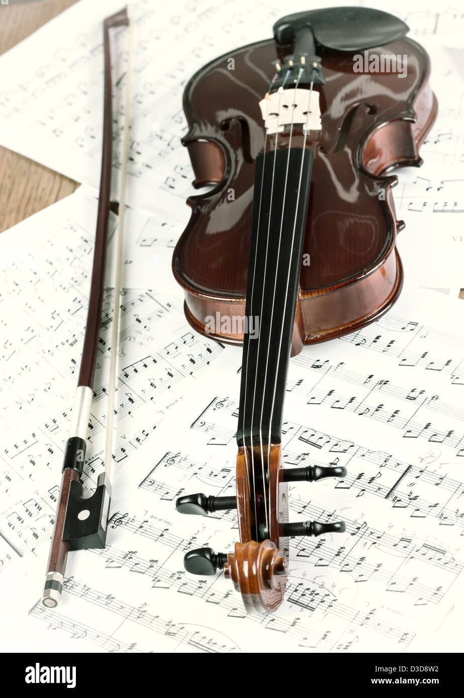 Old violin on table Stock Photo