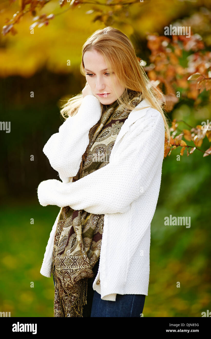 Girl thinking outdoors Stock Photo