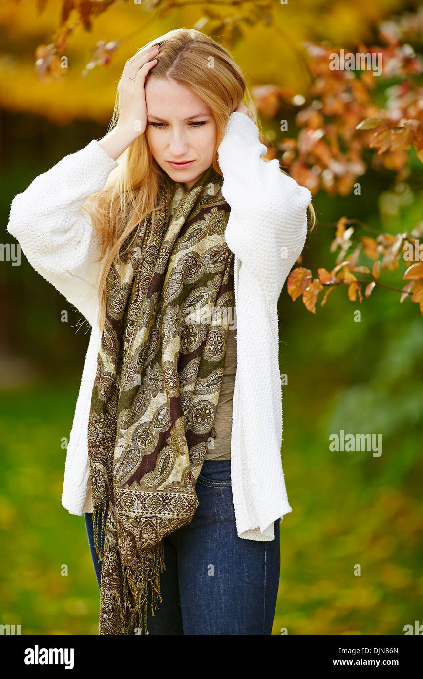 Girl thinking outdoors Stock Photo