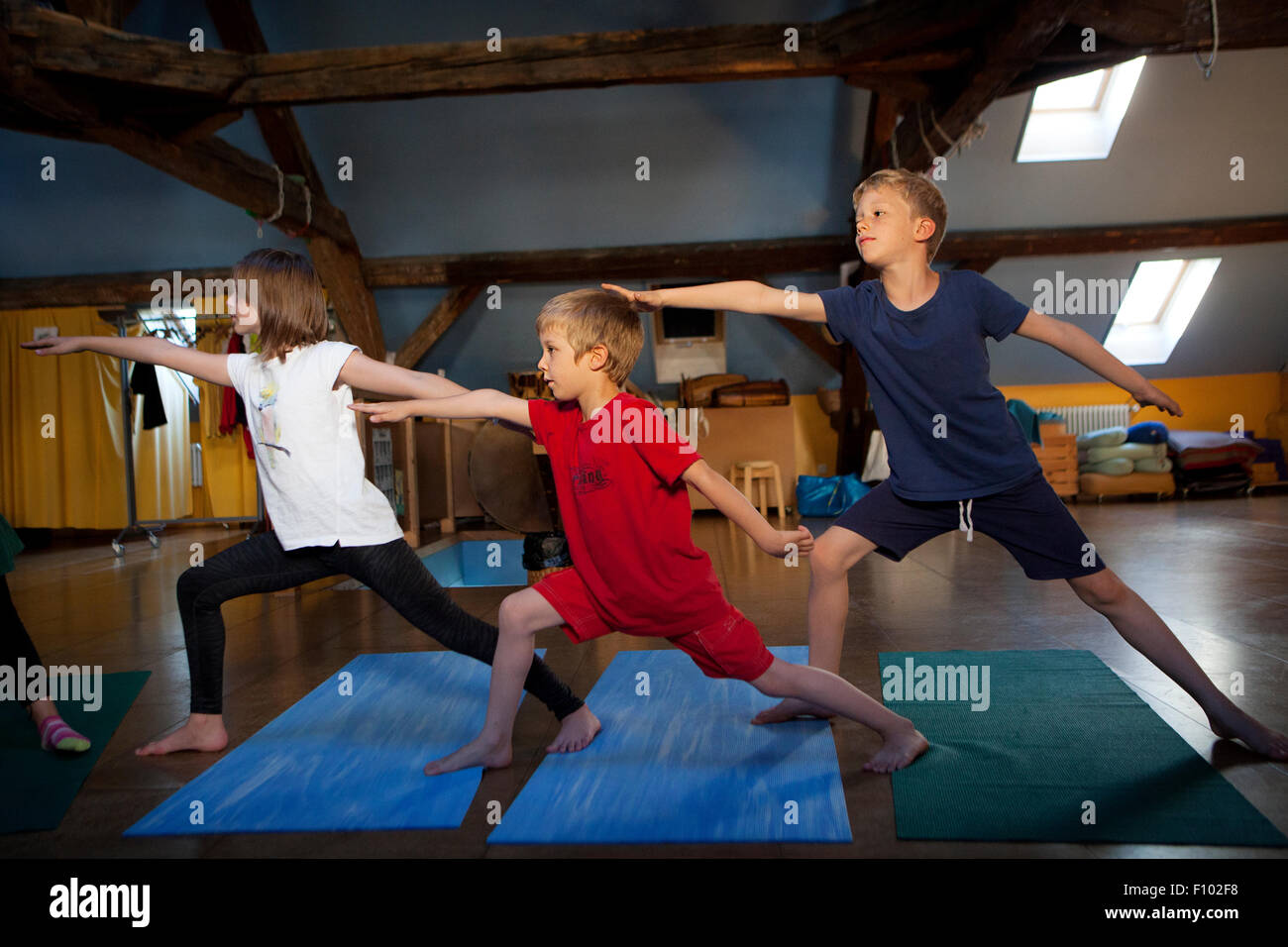 CHILD PRACTICING YOGA Stock Photo