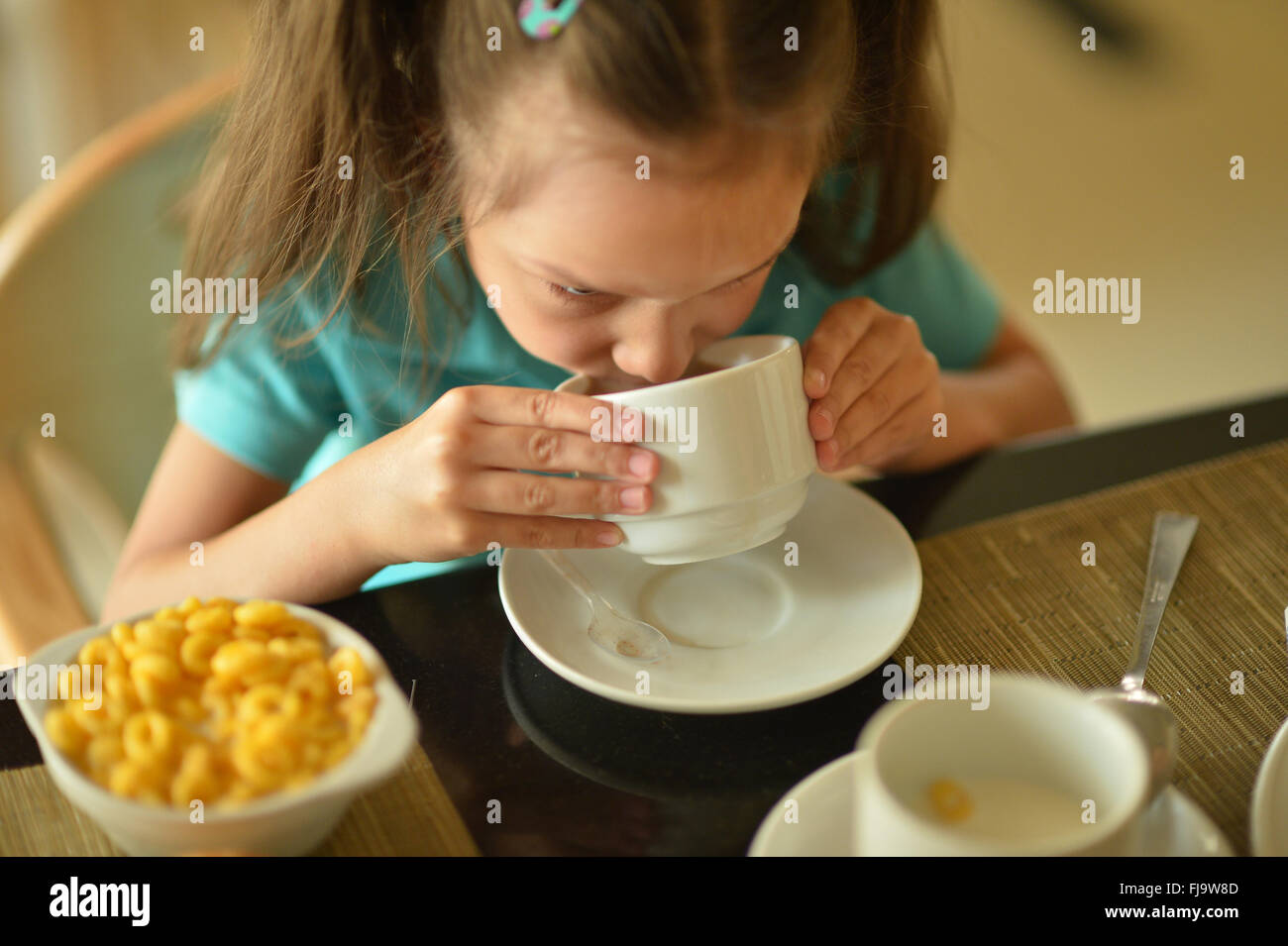 little girl at breakfast Stock Photo