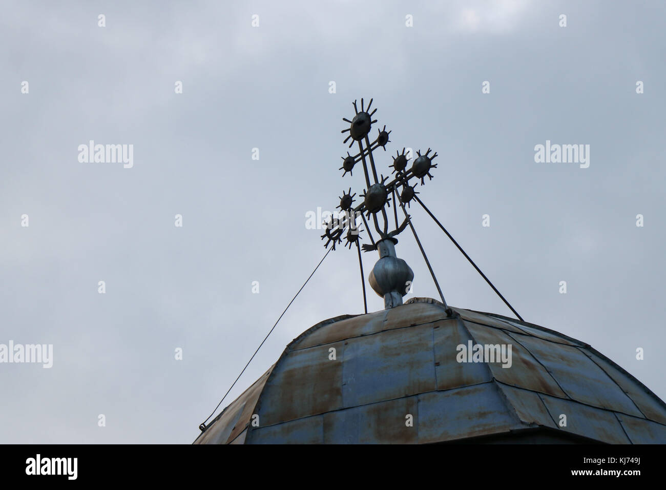 Iron cross on sheet church Stock Photo