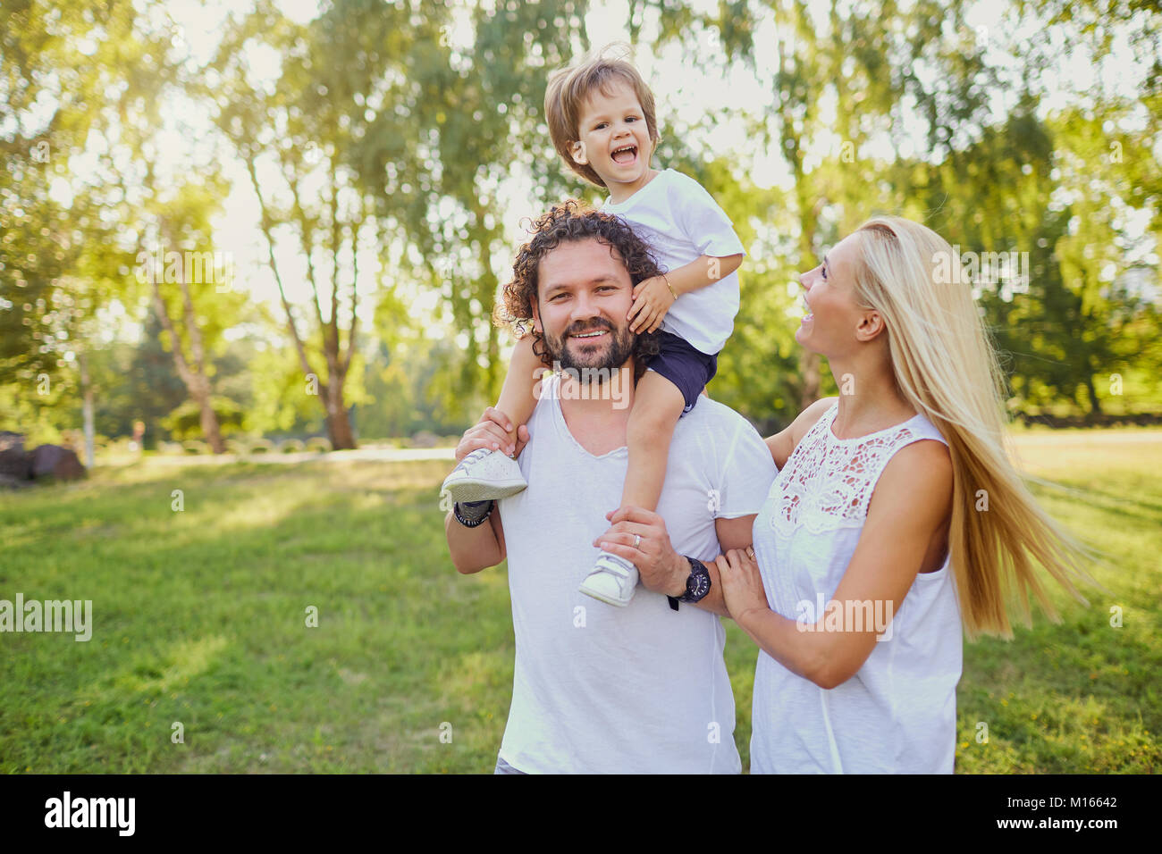 Happy family in the park.  Stock Photo