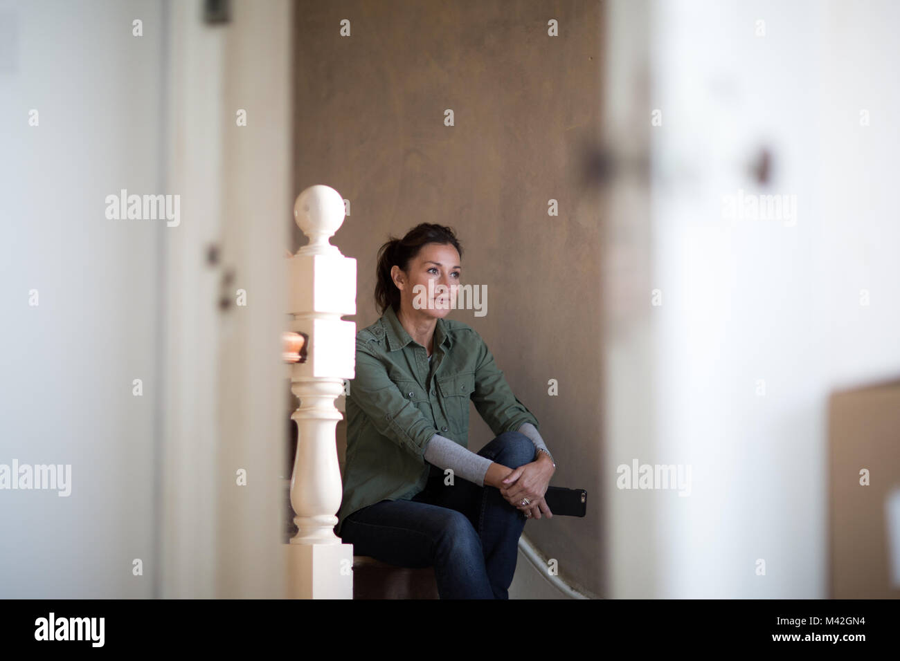 Mature female moving home Stock Photo