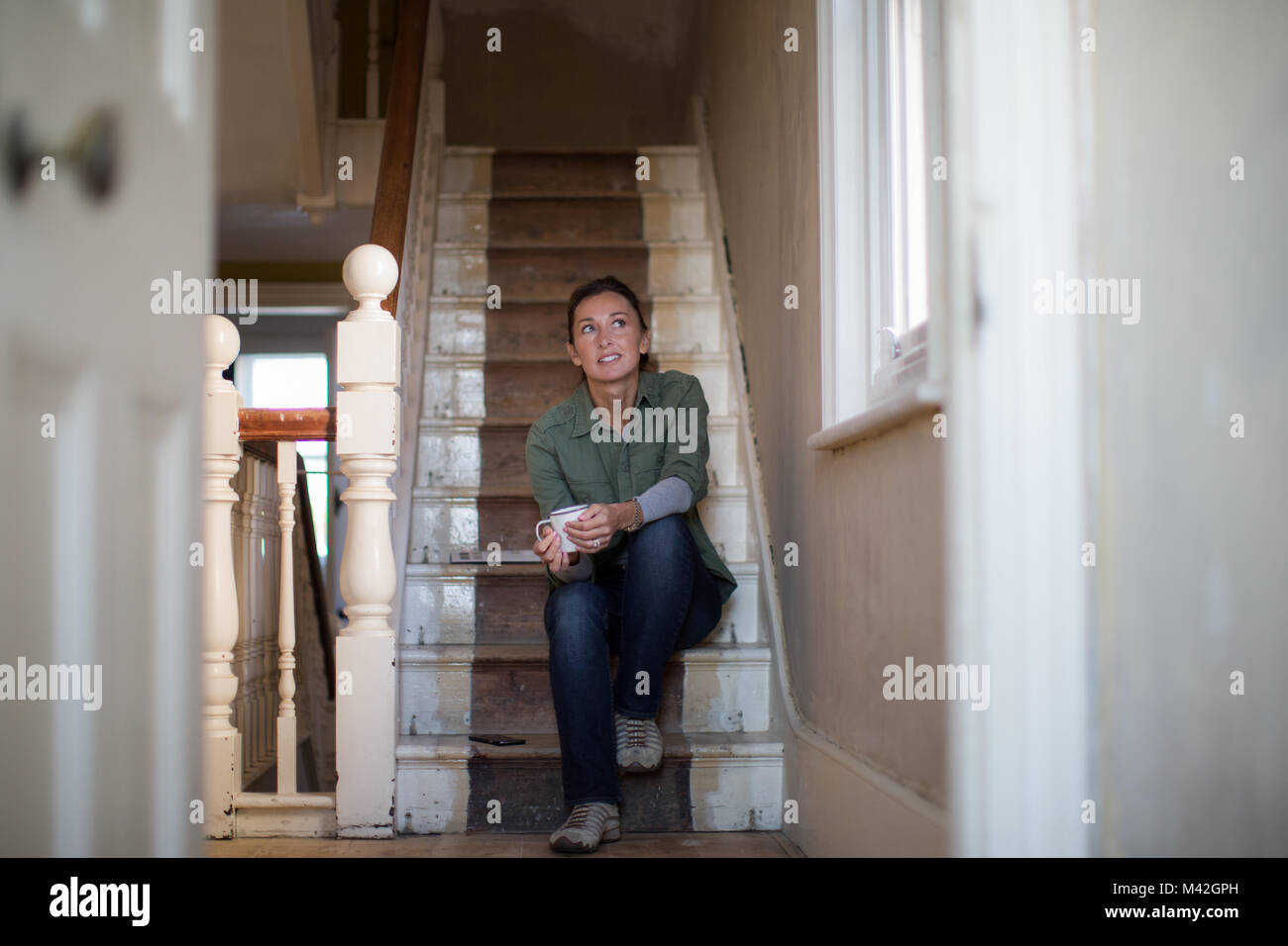 Mature female moving home Stock Photo