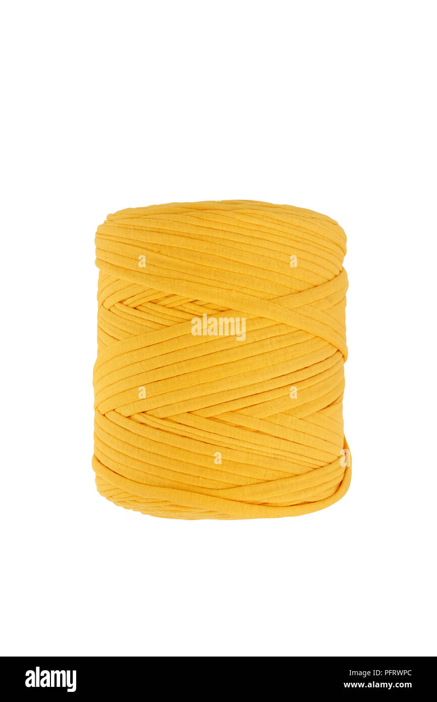 Ball of thick yellow yarn Stock Photo