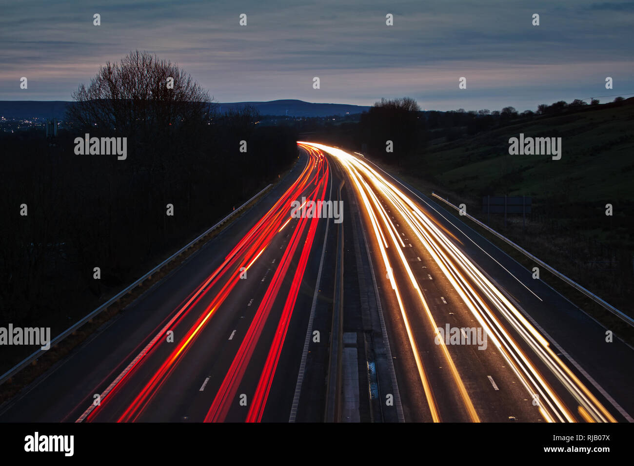 Light trails at dusk Stock Photo