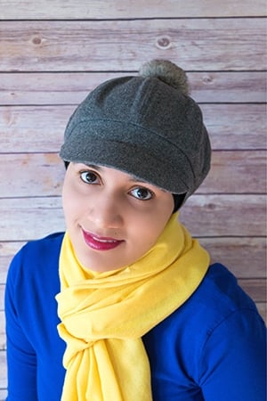 Author Shot of Abeer Rizvi From CakeWhiz Website on Rustic Wood Background