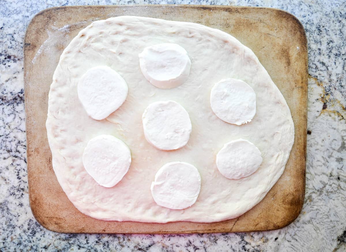 Mozzarella on pizza dough