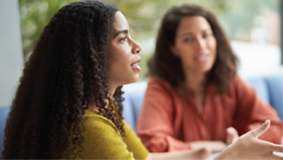 Two colleagues in a meeting.