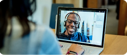 A woman using video chat software to speak with a consultant