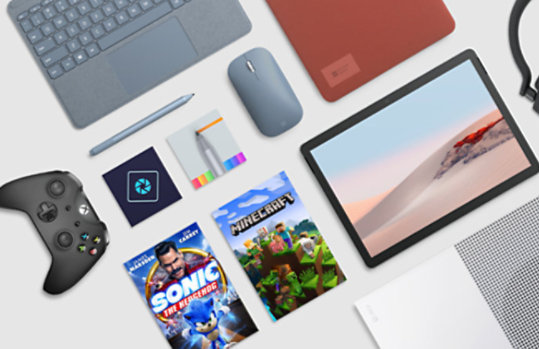 A Surface Go 3 with poppy red accessories, a Samsung smart watch, Surface Earbuds, an Xbox controller, with Minecraft, and Xbox Game Pass Ultimate.