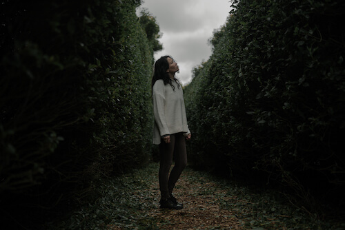 Image of a woman walking through a maze