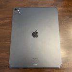 The back of an iPad with its Apple logo centered