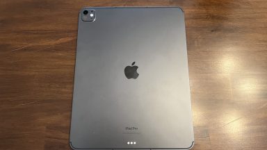 The back of an iPad with its Apple logo centered