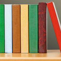 Row of colorful books on a bookshelf. Stack of books, pile of books, literature, reading. Homepage 2010, arts and entertainment, history and society