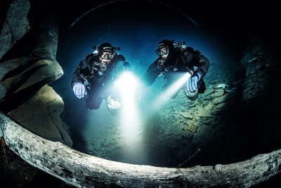 two divers in a cave