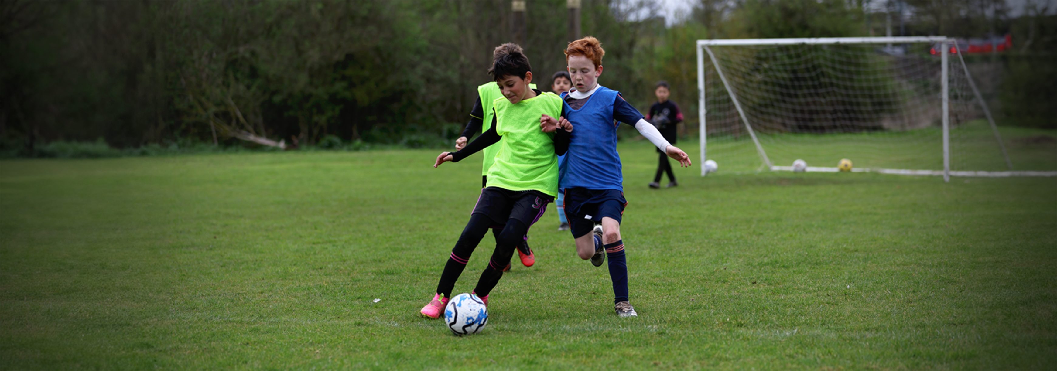 A player looks to challenge a player dribbling with the ball.