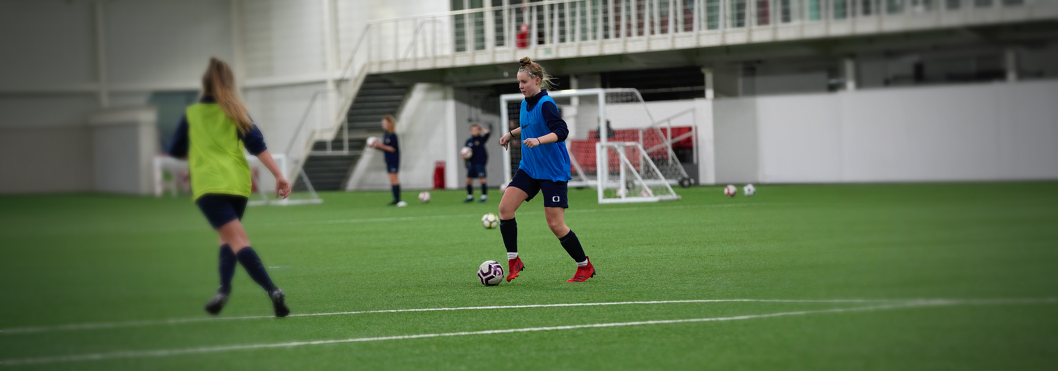 A player dribbles with the ball.