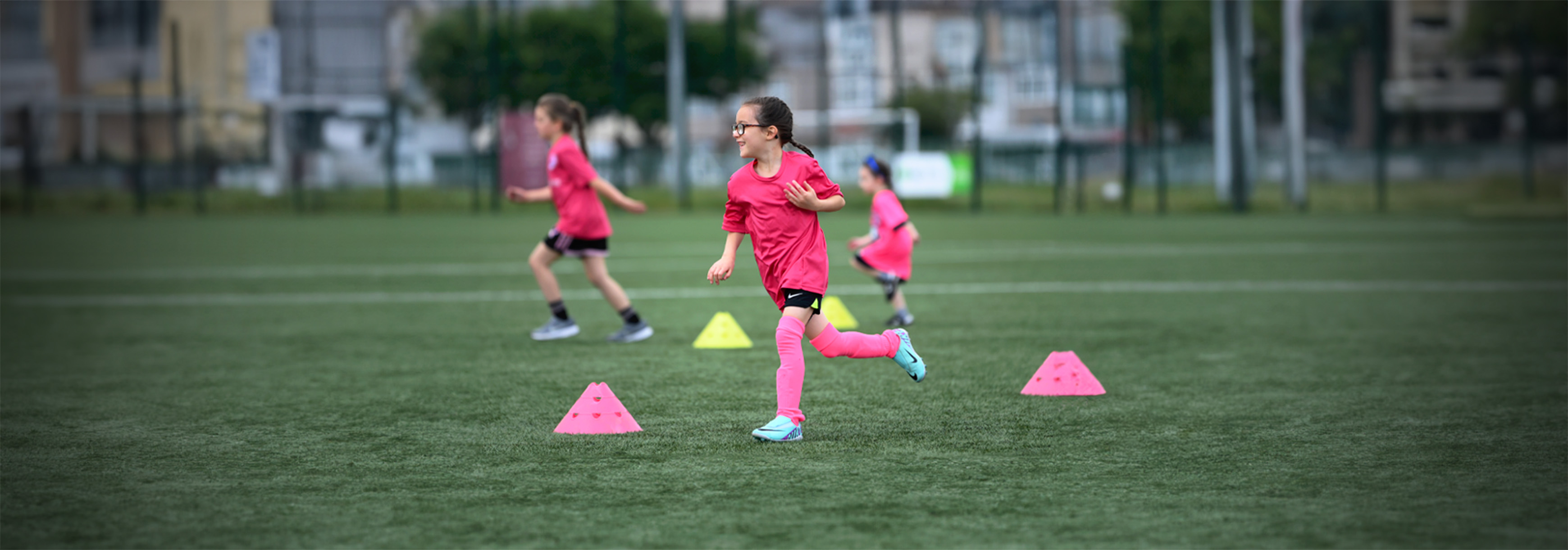 A player runs around a set of cones