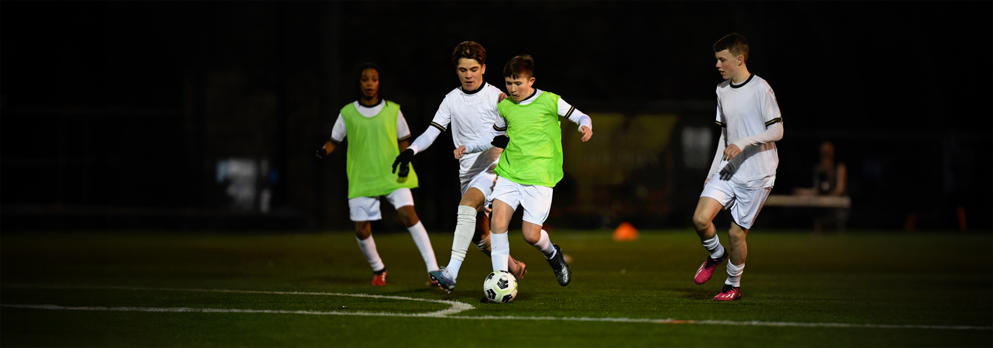 A player dribbles past a few opponents.